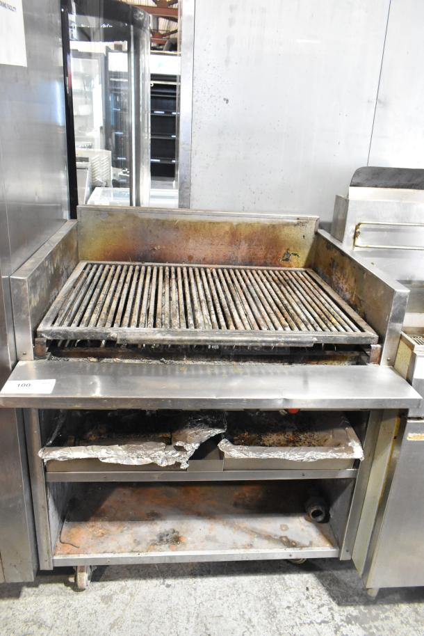 MagiKitch'n FM RMB 36 stainless steel charbroiler grill with under shelf, commercial casters, natural gas powered, used condition.