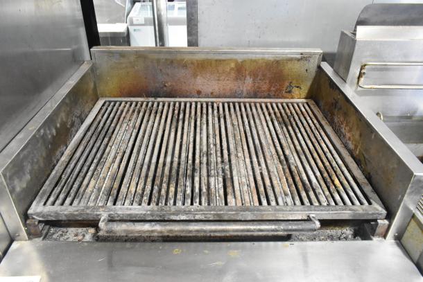 MagiKitch'n FM RMB 36 stainless steel charbroiler, natural gas, under shelf, on commercial casters, used condition.