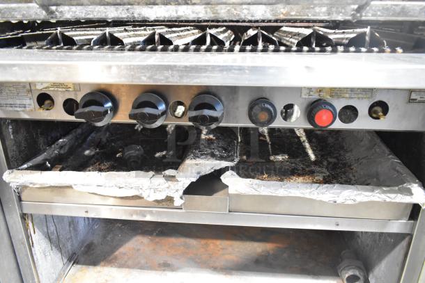 MagiKitch'n FM RMB 36 stainless steel charbroiler grill with natural gas power, under shelf, commercial casters; used condition.