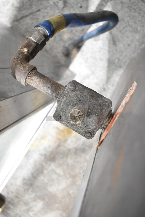 MagiKitch'n FM RMB 36 stainless steel charbroiler grill, visible gas connection, good condition, commercial casters.