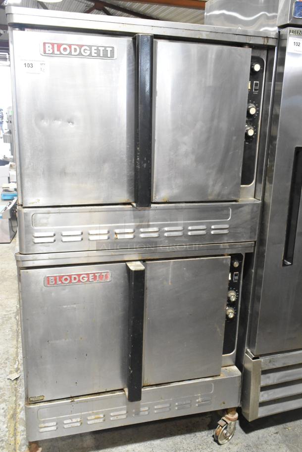 Blodgett stainless steel gas convection ovens with solid doors, metal racks, and thermostatic controls on commercial casters.