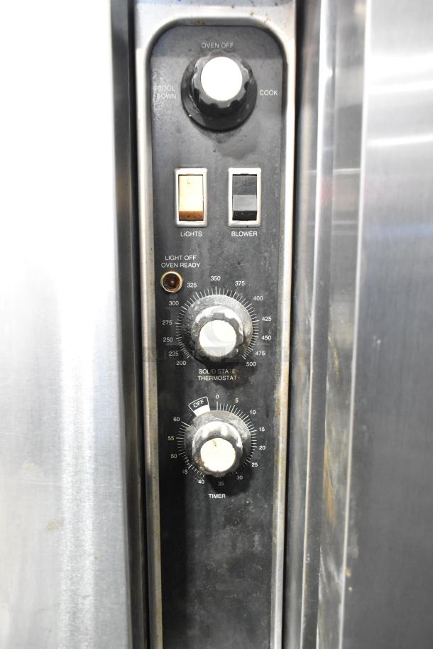 Blodgett commercial stainless steel convection oven control panel with thermostatic controls and timer.