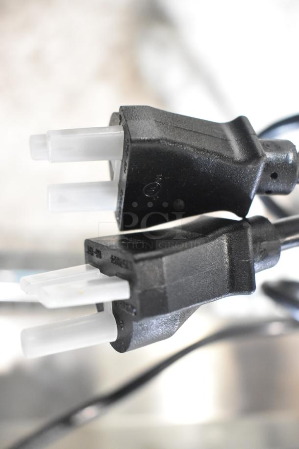 Power cord plug for 2025 Vollrath FFA8110 countertop electric fryer, black plastic, three-prong design, in good condition.