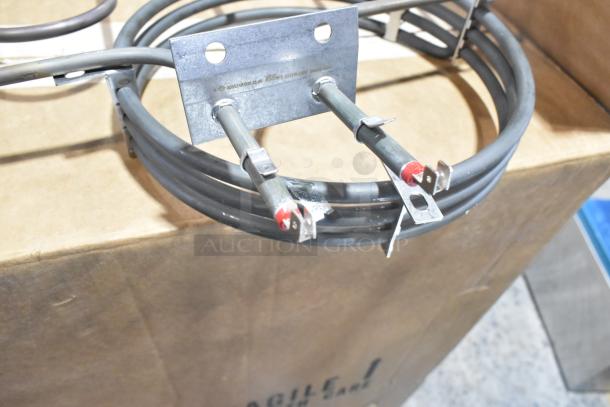 Two metal burners with coiled design, connected by a metal bracket, shown in good condition. Includes bid multiplier offer.