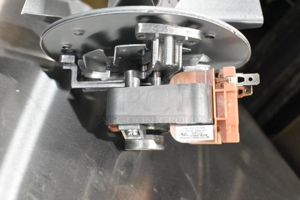 Brand new metal convection oven fan, identified as scratch and dent. Label reads 110-120V AC, 60Hz, 35W.