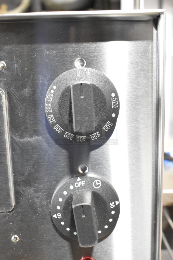 Avantco 177CPO16TS stainless steel pizza oven, close-up of adjustable thermostatic control knobs, new condition.