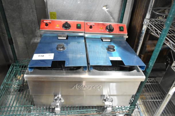 Brand new Avantco 177F202 stainless steel 30 lb. dual tank electric fryer with 2 metal fry baskets and lids, 208-240V.