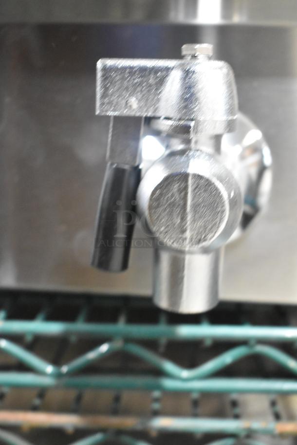 Stainless steel spout of 2024 Avantco 177F202 dual tank electric fryer, showing detail of handle and connection.