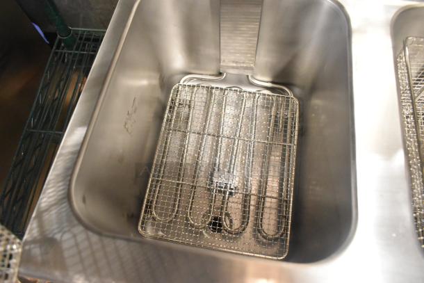 Avantco 177F202 electric fryer, 30 lb. capacity, dual tank, stainless steel, includes metal fry basket, new with minor scratches.