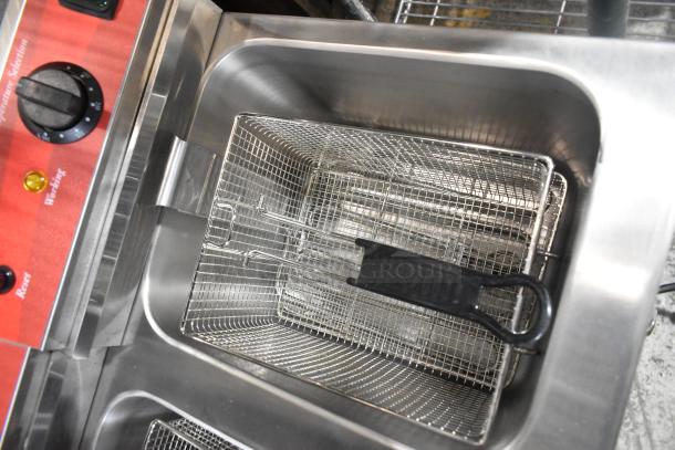 Brand new 2024 Avantco 177F202 stainless steel dual tank electric fryer, 30 lb capacity, with two metal baskets and lids.