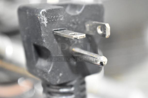 Close-up of a power plug from the Avantco 177F202 electric countertop fryer, showing a three-prong design.