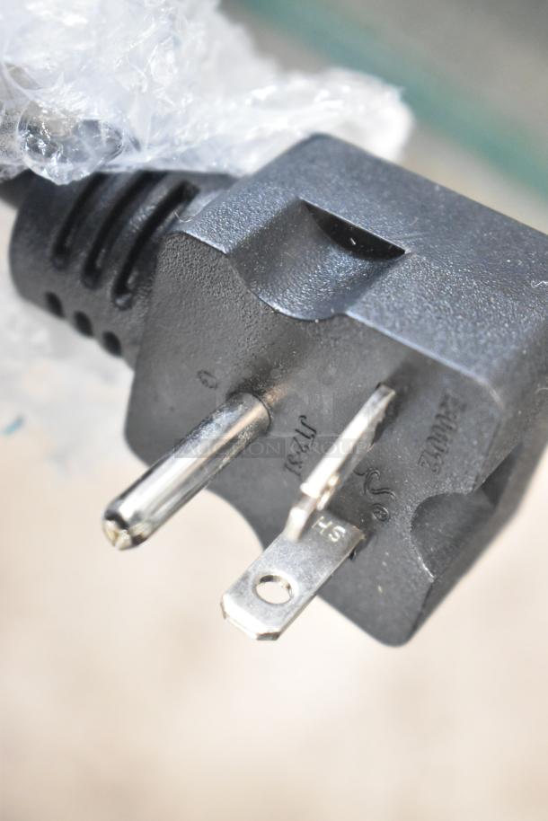 Close-up of a power plug for the Avantco 177F202 fryer. Plastic wrap partially visible. Plug details embossed.
