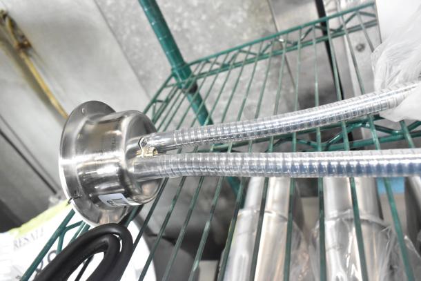 Brand new CK2527B316 metal commercial 2-head heat lamp, 120V, 1 phase, with slight cosmetic scratches and dents.