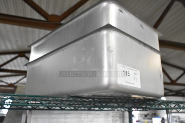 Brand new Vollrath 99765 spillage pan, 6 3/8" deep, full size, stainless steel, minor scratches/dents. Auction label visible.