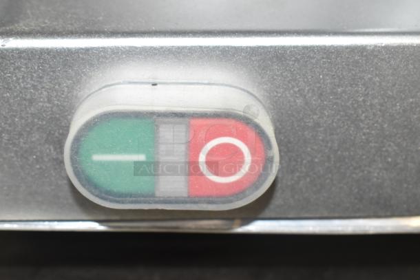 Avantco SL512 12" meat slicer power button, red (off) and green (on), indicates manual control for 115V, 1 phase operation.
