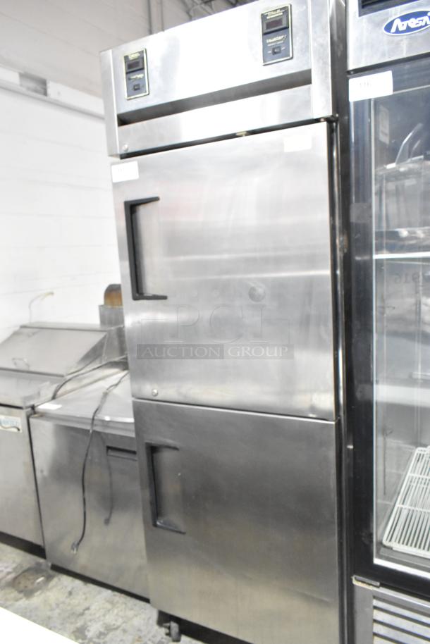 True TA1DT-2HS stainless steel commercial cooler with 2 half-size doors, on casters. Powered by 115 volts, 1 phase.