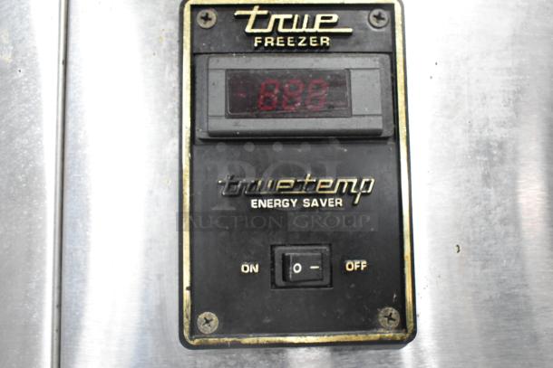 True TA1DT-2HS cooler control panel with True Freezer and TruTemp Energy Saver labels, showing digital display and switch.