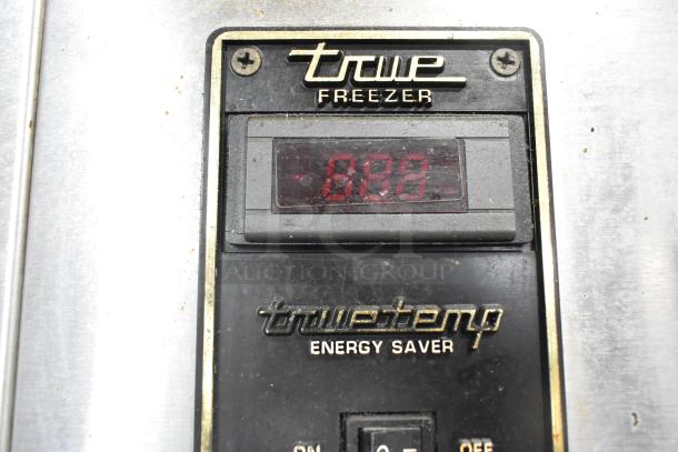 True TA1DT-2HS stainless steel cooler control panel with True logo and digital display reading "-00". Energy saver label visible.