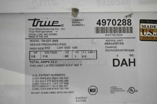 True TA1DT-2HS cooler label, showing model, voltage 115, phase 1, serial number 4970288, refrigerant R134A.