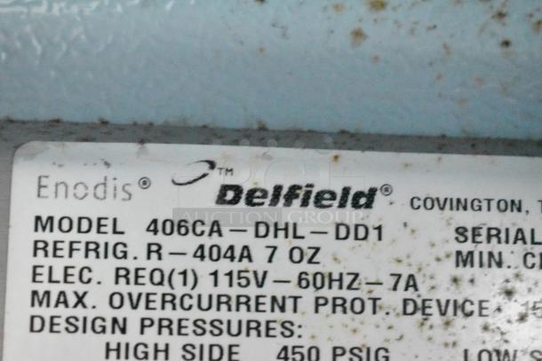 Delfield 406CA-DHL-DD1 commercial undercounter cooler label, stainless steel, 115V, 1 phase, model info visible.