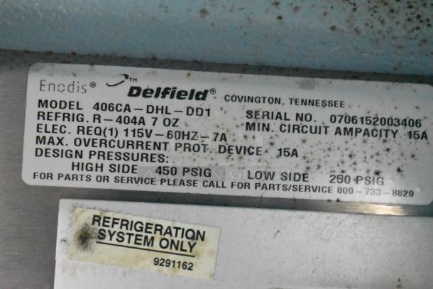 Delfield 406CA-DHL-DD1 stainless steel commercial undercounter cooler, single door, 115V, 1 Phase, model label shown.