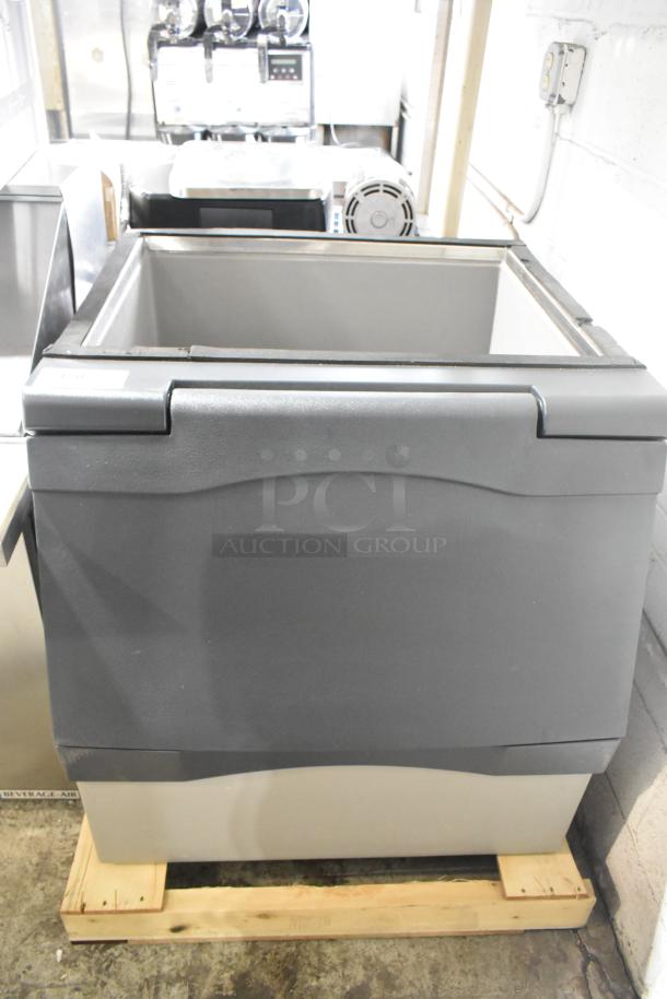 BRAND NEW 2025 Scotsman B330P stainless steel commercial ice storage bin, 344 lb. capacity, minor scratches and dents visible.