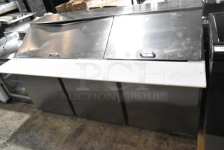 Beverage Air SPE72HC-30M 72" 3-door mega top refrigerated sandwich prep table, new with cosmetic dents. Stainless steel.