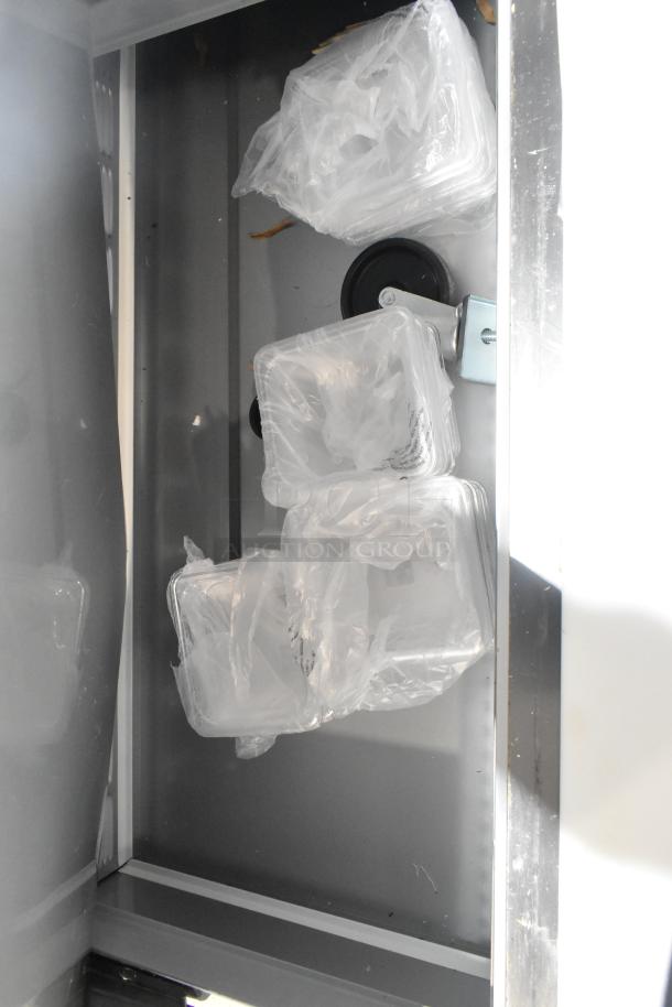 Beverage Air SPE72HC-30M Elite Series Refrigerated Prep Table interior, showing plastic bins in packaging.