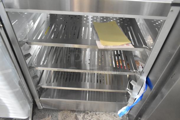 Carnival King 382HPW18D2S stainless steel commercial warmer, 18", new scratch and dent, three perforated shelves visible.