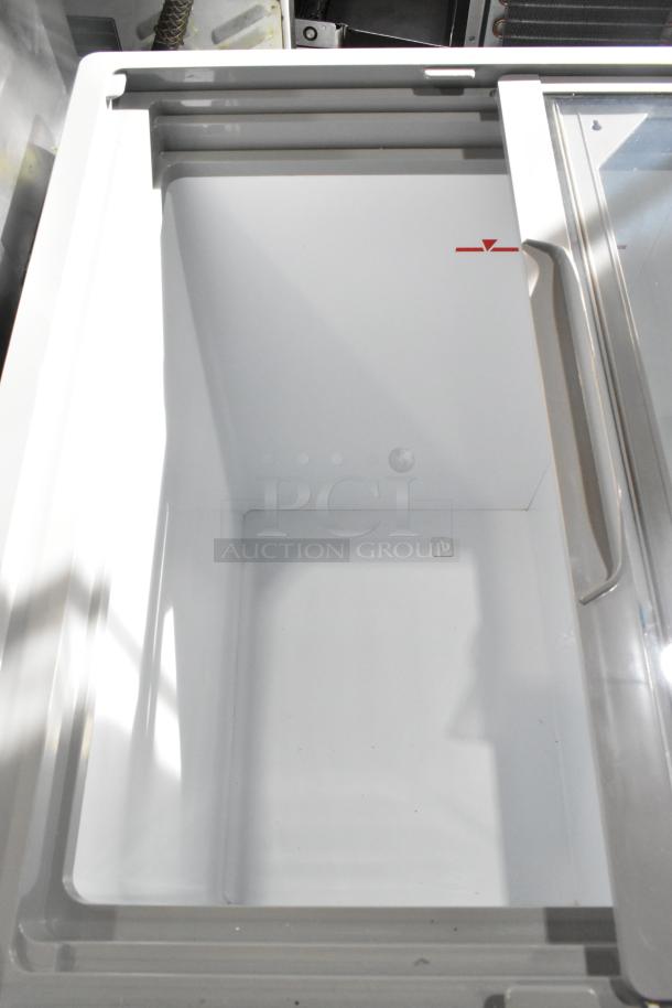 "Excellence HB-7HCD-CHB display cabinet, dual temperature, 7.4 cu. ft., new with minor scratches, clear glass lid."