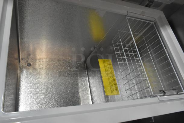 Brand new Galaxy 177CF10HC commercial chest freezer, 9.6 cu. ft., 115V, scratch and dent, with interior wire basket and label.