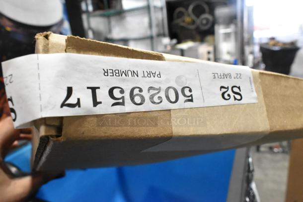 Cardboard box with visible label marked "Part Number 502961." Partially opened, showing contents inside.