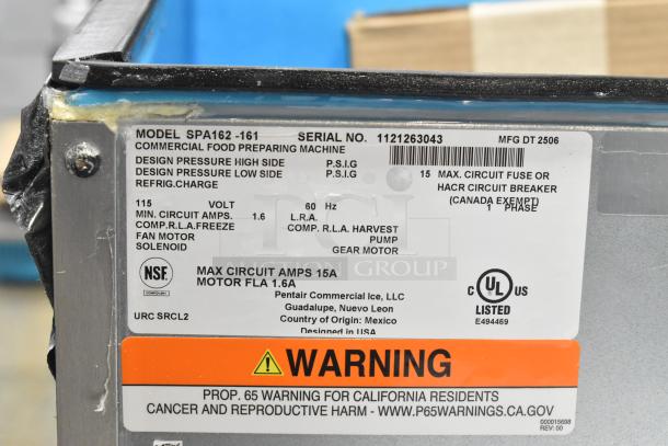 Brand new 2025 Manitowoc SPA162-161 Touchless Hotel Ice Dispenser, 120 lb capacity, 115V, 1 Phase. Model and warning labels shown.