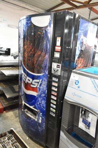 Metal commercial bottle drink vending machine with Pepsi branding, 115 volts, 1 phase. Visible button panel and coin slot.