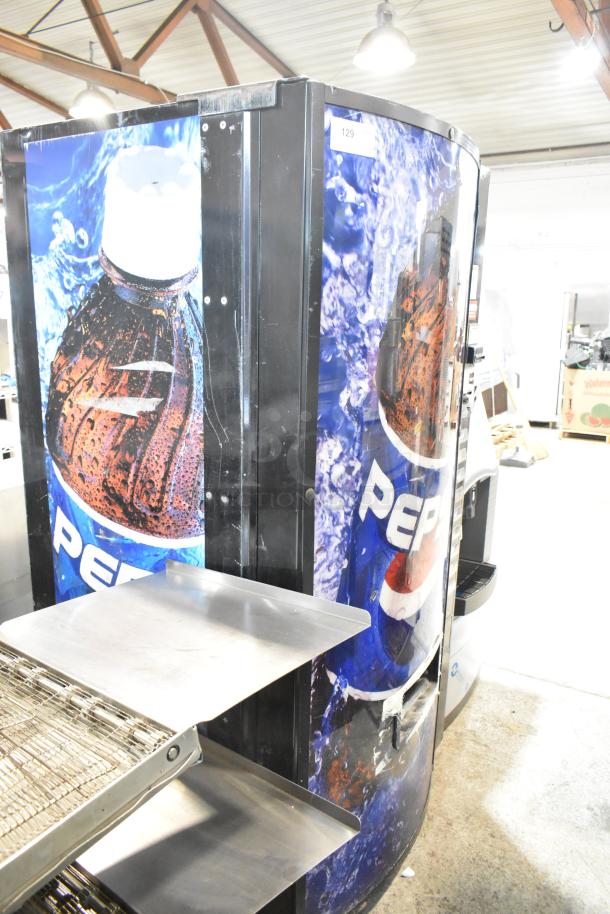 Metal commercial bottle drink vending machine, Pepsi branding. 115 volts, 1 phase. Silver shelves, fair condition.