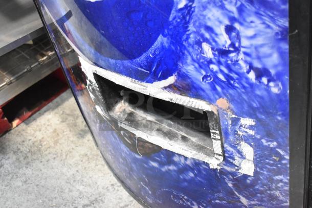 Metal commercial bottle drink vending machine with water-themed design. 115 volts, 1 phase. Wear around the dispensing slot.