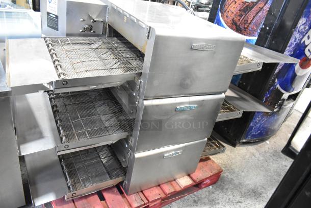 3 Turbochef HhC2020 stainless steel conveyor ovens, used, 208/240V, 3-phase, on wooden pallet, visible brand logo.
