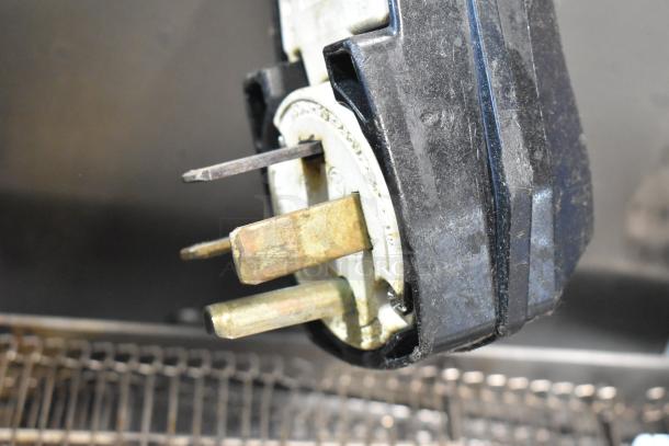 Close-up of a plug from a 2017 Turbochef HhC2020 stainless steel commercial electric conveyor oven, 208/240 Volts, 3 Phase.