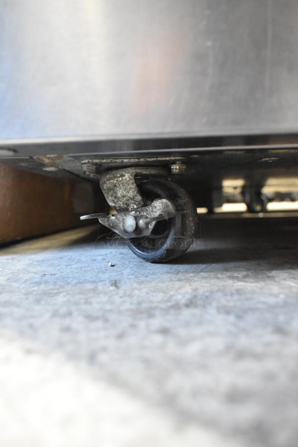 2021 Delfield 406P-STAR4 undercounter cooler with stainless steel finish, shown on commercial caster, 115V, 1 phase.