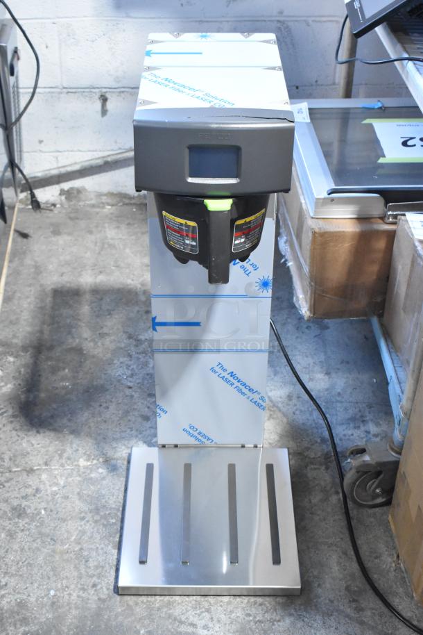 Brand new 2023 Fetco TBS-2121 stainless steel twin 3.5-gallon iced tea brewer, scratch and dent, 120V, 1-phase.