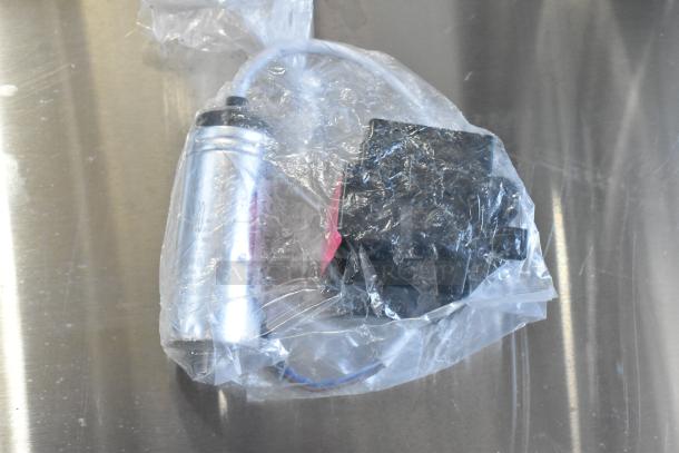 6 new scratch and dent items, including 17828004C compressor cover, wrapped in plastic. Model U.24.01.59B visible.