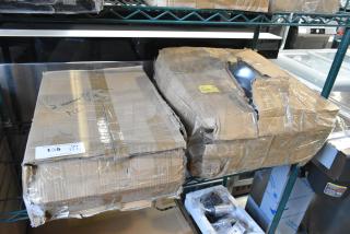 Two brand new scratch and dent items in damaged boxes, including a chafing dish. Labels and markings visible.