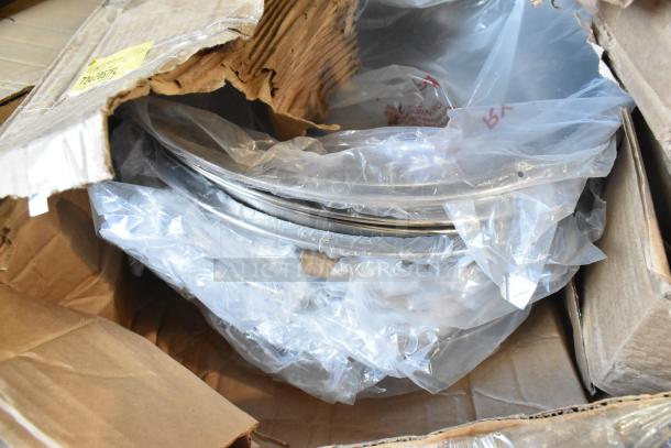 Brand new scratch and dent chafing dish in open box, wrapped in plastic. Cardboard shows minor wear.