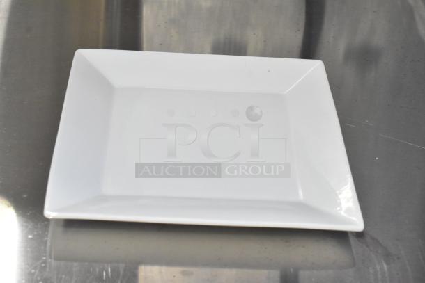 Acopa white ceramic plate, square, scratch and dent condition, smooth glossy finish, visible minor imperfections.
