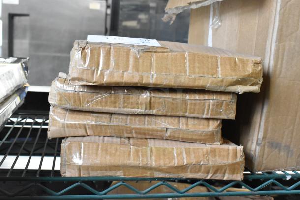 Four new Acopa white ceramic plates in original packaging, labeled as scratch and dent. Boxes stacked, indicating condition.