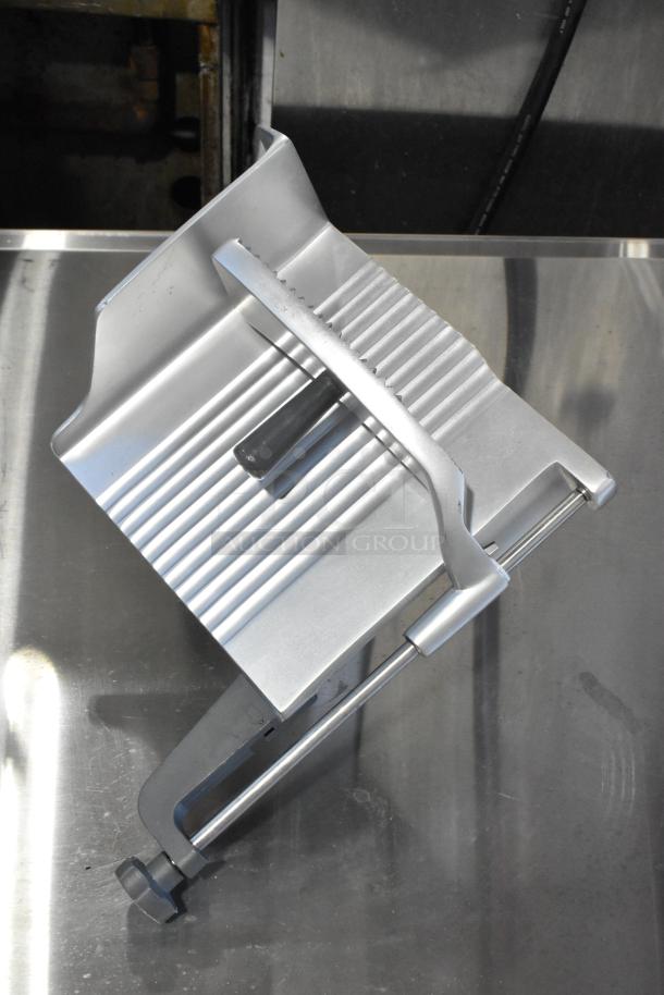 Brand new metal commercial carriage for meat slicer, featuring minor scratches, robust steel construction, and ergonomic handle.