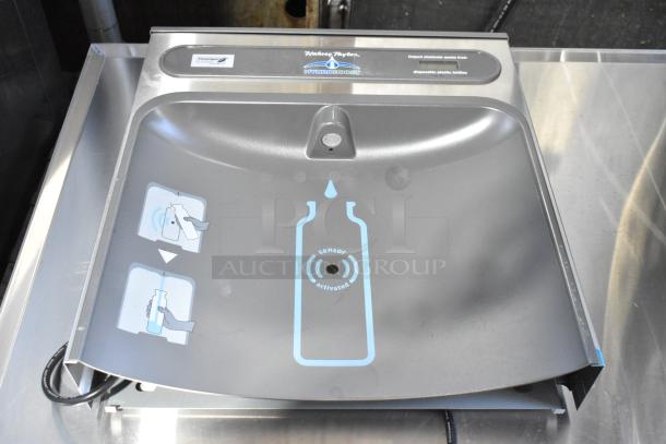 Brand new Elkay HAC-HB-NF-1C metal water bottle filling attachment, scratch and dent condition, with clear sensor labels.