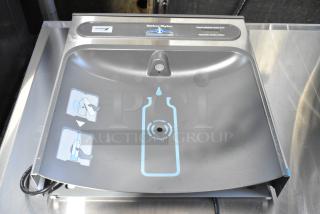 Brand new Elkay HAC-HB-NF-1C metal water bottle filling attachment, scratch and dent condition, with clear sensor labels.