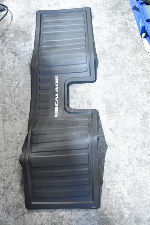 Brand new Escalade mat with embossed name, durable design, black color, made for protective use. Scratch and dent sale item.
