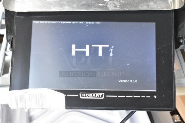 2016 Hobart HTi-7LH Metal Countertop Scale with label printer, touchscreen display, and Hobart logo. Version 3.5.0 shown.
